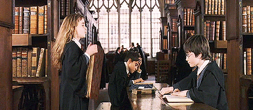 Hermione from Harry Potter carrying a huge book from "School Then Vs. School Now" lernin blog